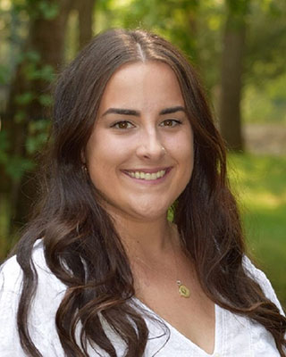 smiling woman with long brown hair